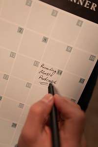 Person Planning Date of Podcast in Calendar